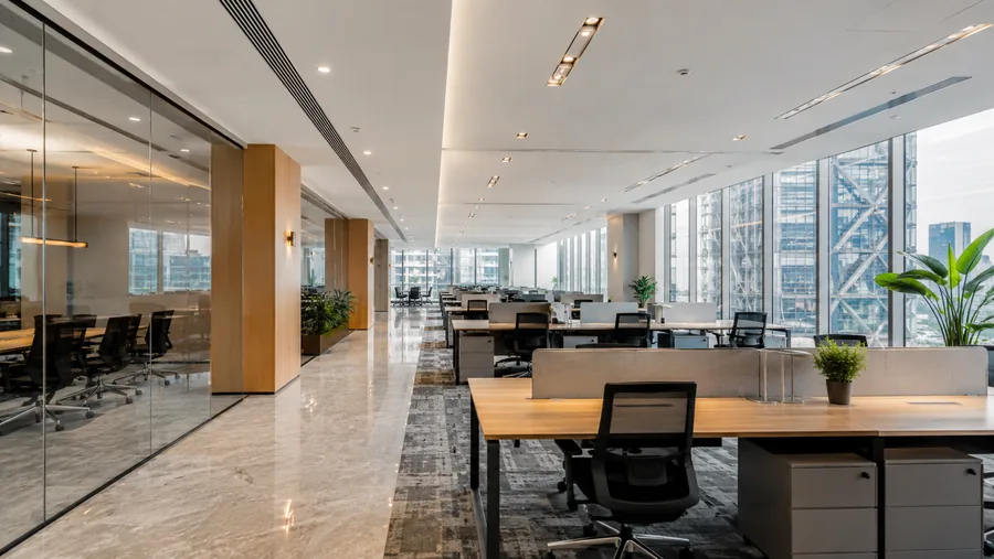 Open-plan Grade-A office floor with glazed meeting rooms and a city outlook